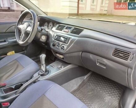 Черный Мицубиси Лансер, объемом двигателя 1.58 л и пробегом 78 тыс. км за 6500 $, фото 25 на Automoto.ua