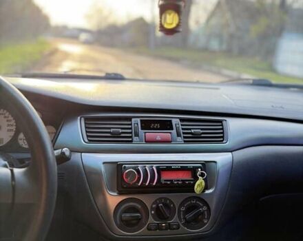 Чорний Міцубісі Lancer, об'ємом двигуна 1.6 л та пробігом 98 тис. км за 5600 $, фото 24 на Automoto.ua