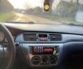 Чорний Міцубісі Lancer, об'ємом двигуна 1.6 л та пробігом 98 тис. км за 5600 $, фото 24 на Automoto.ua