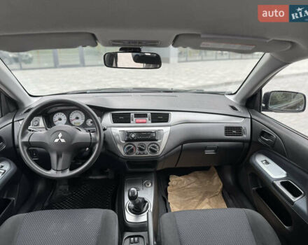 Чорний Міцубісі Lancer, об'ємом двигуна 1.58 л та пробігом 128 тис. км за 5999 $, фото 25 на Automoto.ua