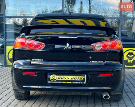 Черный Мицубиси Лансер, объемом двигателя 2 л и пробегом 215 тыс. км за 7000 $, фото 5 на Automoto.ua