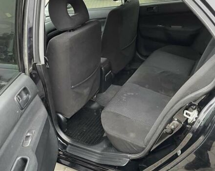 Чорний Міцубісі Lancer, об'ємом двигуна 1.6 л та пробігом 186 тис. км за 5500 $, фото 11 на Automoto.ua