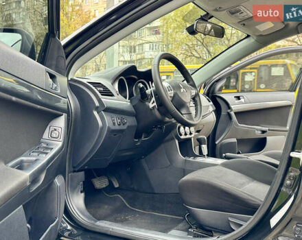 Черный Мицубиси Лансер, объемом двигателя 2 л и пробегом 221 тыс. км за 6750 $, фото 37 на Automoto.ua