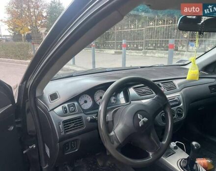 Чорний Міцубісі Lancer, об'ємом двигуна 1.6 л та пробігом 220 тис. км за 3000 $, фото 1 на Automoto.ua