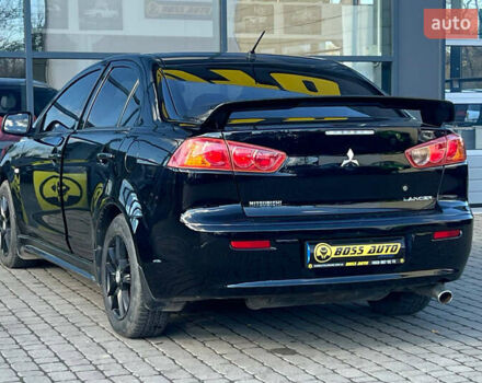Черный Мицубиси Лансер, объемом двигателя 2 л и пробегом 215 тыс. км за 7000 $, фото 4 на Automoto.ua