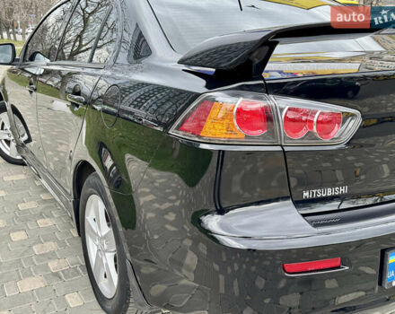 Черный Мицубиси Лансер, объемом двигателя 2 л и пробегом 221 тыс. км за 6750 $, фото 18 на Automoto.ua