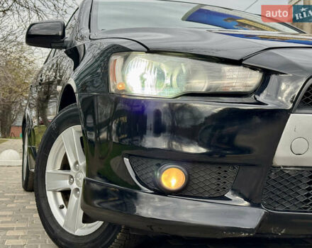 Черный Мицубиси Лансер, объемом двигателя 2 л и пробегом 221 тыс. км за 6750 $, фото 12 на Automoto.ua