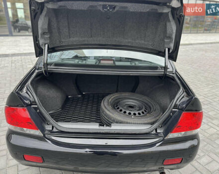 Чорний Міцубісі Lancer, об'ємом двигуна 1.58 л та пробігом 128 тис. км за 5999 $, фото 26 на Automoto.ua