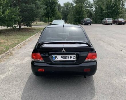 Черный Мицубиси Лансер, объемом двигателя 1.58 л и пробегом 240 тыс. км за 5100 $, фото 3 на Automoto.ua