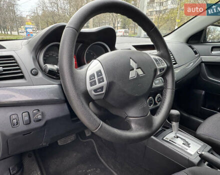 Черный Мицубиси Лансер, объемом двигателя 2 л и пробегом 221 тыс. км за 6750 $, фото 43 на Automoto.ua