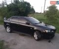 Чорний Міцубісі Lancer, об'ємом двигуна 2 л та пробігом 180 тис. км за 6999 $, фото 4 на Automoto.ua