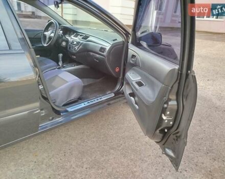 Черный Мицубиси Лансер, объемом двигателя 1.58 л и пробегом 78 тыс. км за 6500 $, фото 20 на Automoto.ua