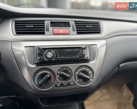 Чорний Міцубісі Lancer, об'ємом двигуна 1.58 л та пробігом 128 тис. км за 5999 $, фото 14 на Automoto.ua
