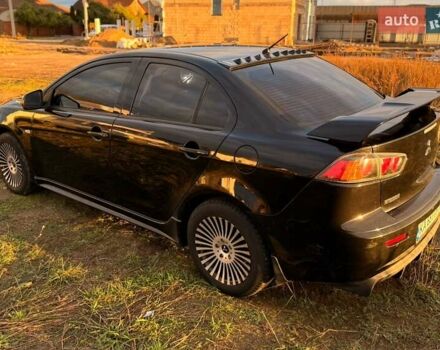 Чорний Міцубісі Lancer, об'ємом двигуна 2 л та пробігом 204 тис. км за 7500 $, фото 3 на Automoto.ua
