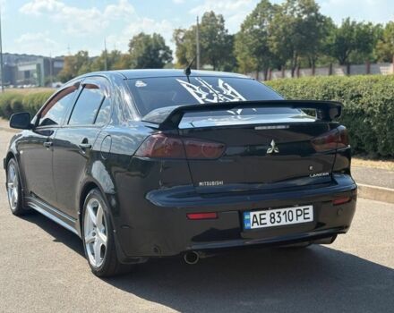 Черный Мицубиси Лансер, объемом двигателя 2 л и пробегом 216 тыс. км за 6950 $, фото 5 на Automoto.ua