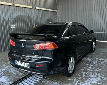 Черный Мицубиси Лансер, объемом двигателя 2 л и пробегом 280 тыс. км за 6900 $, фото 1 на Automoto.ua