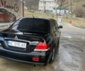 Чорний Міцубісі Lancer, об'ємом двигуна 1.59 л та пробігом 309 тис. км за 3900 $, фото 1 на Automoto.ua