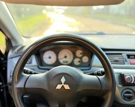 Чорний Міцубісі Lancer, об'ємом двигуна 1.6 л та пробігом 98 тис. км за 5600 $, фото 26 на Automoto.ua