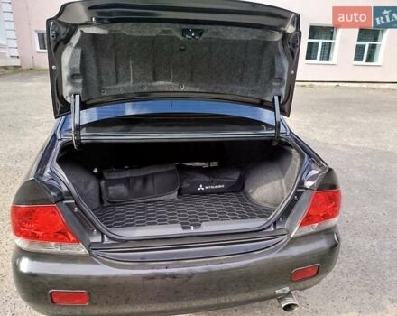 Черный Мицубиси Лансер, объемом двигателя 1.58 л и пробегом 78 тыс. км за 6500 $, фото 19 на Automoto.ua