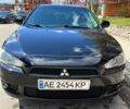 Черный Мицубиси Лансер, объемом двигателя 2 л и пробегом 189 тыс. км за 7250 $, фото 1 на Automoto.ua