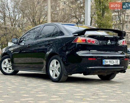 Черный Мицубиси Лансер, объемом двигателя 2 л и пробегом 221 тыс. км за 6750 $, фото 14 на Automoto.ua