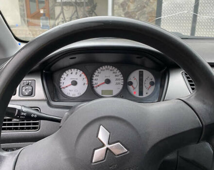 Чорний Міцубісі Lancer, об'ємом двигуна 1.58 л та пробігом 287 тис. км за 4750 $, фото 10 на Automoto.ua