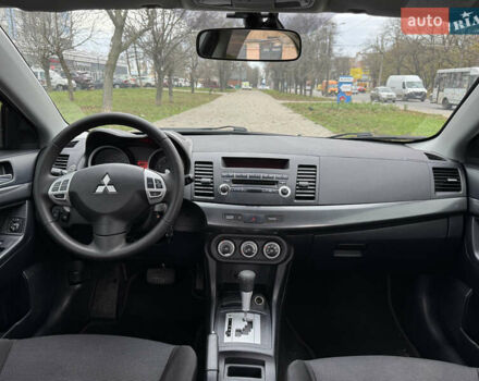 Черный Мицубиси Лансер, объемом двигателя 2 л и пробегом 221 тыс. км за 6750 $, фото 41 на Automoto.ua