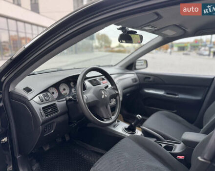 Чорний Міцубісі Lancer, об'ємом двигуна 1.58 л та пробігом 128 тис. км за 5999 $, фото 18 на Automoto.ua