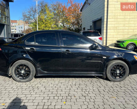 Черный Мицубиси Лансер, объемом двигателя 2 л и пробегом 215 тыс. км за 7000 $, фото 7 на Automoto.ua