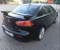 Чорний Міцубісі Lancer, об'ємом двигуна 2 л та пробігом 220 тис. км за 7999 $, фото 1 на Automoto.ua