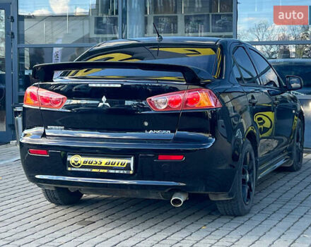 Черный Мицубиси Лансер, объемом двигателя 2 л и пробегом 215 тыс. км за 7000 $, фото 6 на Automoto.ua