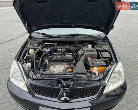 Чорний Міцубісі Lancer, об'ємом двигуна 1.58 л та пробігом 128 тис. км за 5999 $, фото 32 на Automoto.ua