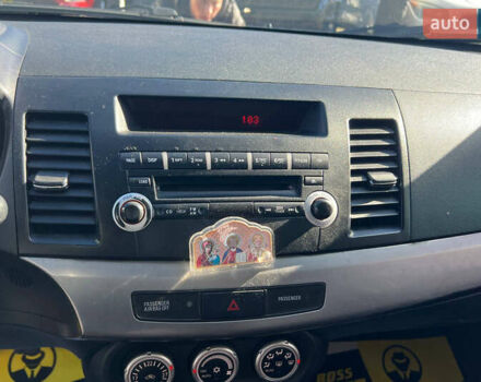 Черный Мицубиси Лансер, объемом двигателя 2 л и пробегом 215 тыс. км за 7000 $, фото 11 на Automoto.ua