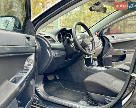 Черный Мицубиси Лансер, объемом двигателя 2 л и пробегом 221 тыс. км за 6750 $, фото 36 на Automoto.ua