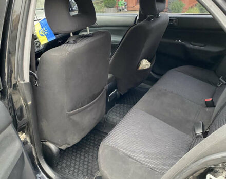 Чорний Міцубісі Lancer, об'ємом двигуна 1.58 л та пробігом 287 тис. км за 4750 $, фото 7 на Automoto.ua