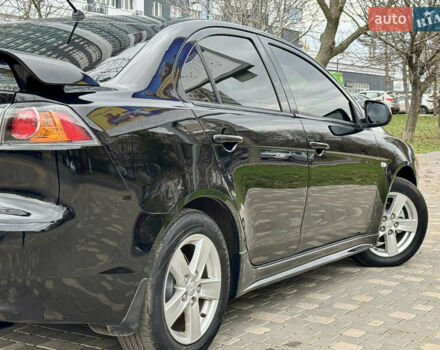 Черный Мицубиси Лансер, объемом двигателя 2 л и пробегом 221 тыс. км за 6750 $, фото 22 на Automoto.ua