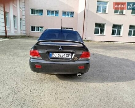 Черный Мицубиси Лансер, объемом двигателя 1.58 л и пробегом 78 тыс. км за 6500 $, фото 2 на Automoto.ua