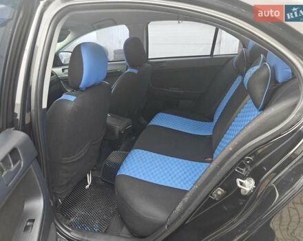 Черный Мицубиси Лансер, объемом двигателя 2 л и пробегом 228 тыс. км за 7000 $, фото 4 на Automoto.ua