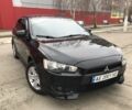 Чорний Міцубісі Lancer, об'ємом двигуна 2 л та пробігом 215 тис. км за 7750 $, фото 1 на Automoto.ua