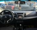 Черный Мицубиси Лансер, объемом двигателя 2 л и пробегом 215 тыс. км за 7000 $, фото 13 на Automoto.ua
