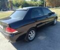 Чорний Міцубісі Lancer, об'ємом двигуна 1.6 л та пробігом 215 тис. км за 5200 $, фото 1 на Automoto.ua