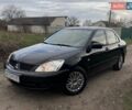 Чорний Міцубісі Lancer, об'ємом двигуна 1.6 л та пробігом 165 тис. км за 3900 $, фото 1 на Automoto.ua