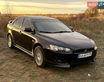 Чорний Міцубісі Lancer, об'ємом двигуна 2 л та пробігом 204 тис. км за 7500 $, фото 1 на Automoto.ua