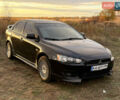 Чорний Міцубісі Lancer, об'ємом двигуна 2 л та пробігом 204 тис. км за 7500 $, фото 1 на Automoto.ua