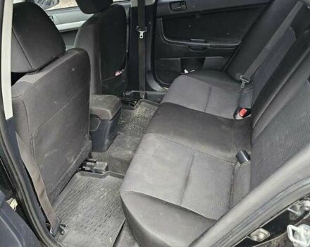 Чорний Міцубісі Lancer, об'ємом двигуна 2 л та пробігом 214 тис. км за 5900 $, фото 1 на Automoto.ua