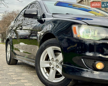 Черный Мицубиси Лансер, объемом двигателя 2 л и пробегом 221 тыс. км за 6750 $, фото 11 на Automoto.ua