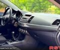 Черный Мицубиси Лансер, объемом двигателя 2 л и пробегом 164 тыс. км за 6950 $, фото 6 на Automoto.ua