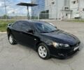 Чорний Міцубісі Lancer, об'ємом двигуна 2 л та пробігом 292 тис. км за 7500 $, фото 1 на Automoto.ua