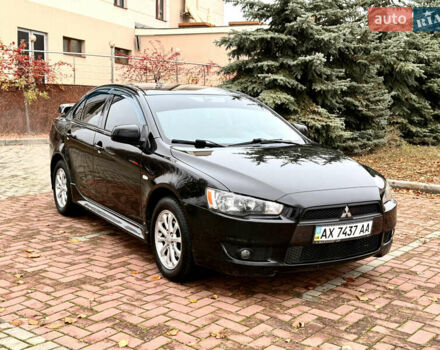 Черный Мицубиси Лансер, объемом двигателя 2 л и пробегом 169 тыс. км за 6800 $, фото 1 на Automoto.ua