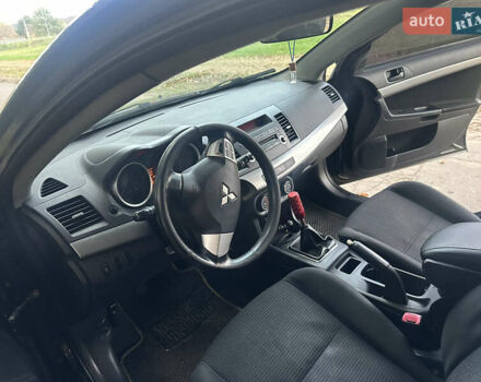 Черный Мицубиси Лансер, объемом двигателя 1.5 л и пробегом 202 тыс. км за 6500 $, фото 35 на Automoto.ua